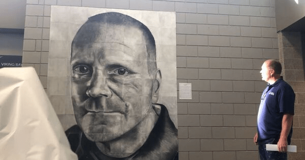 'The Unsung Hero' - High school students honor beloved custodian with massive hand-drawn portrait. Credit: Seaman High School