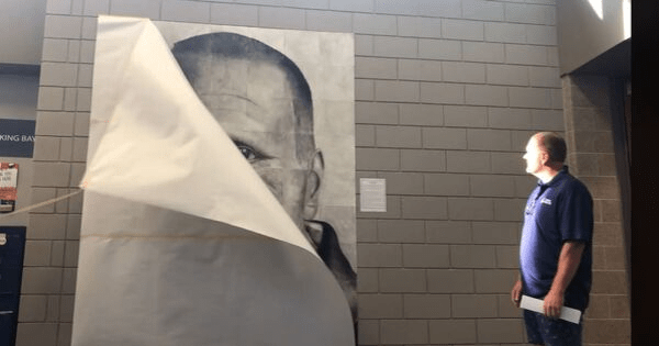 'The Unsung Hero' - High school students honor beloved custodian with massive hand-drawn portrait. 