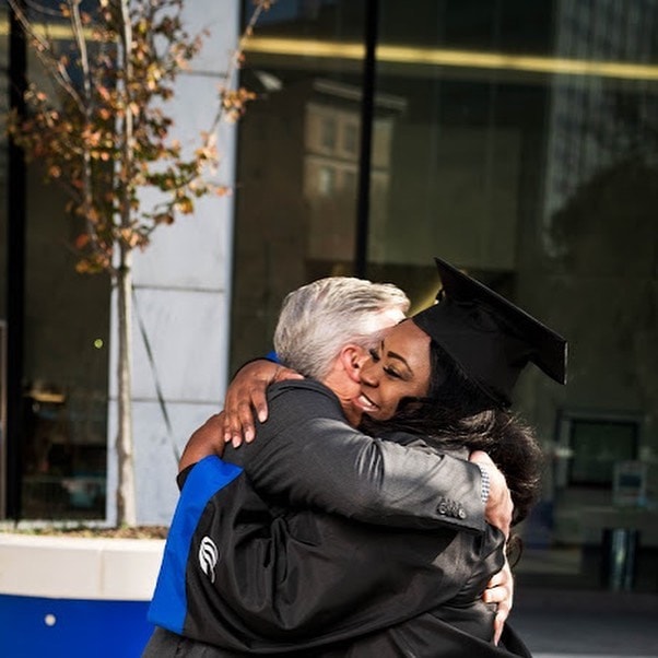 Uber driver earns college degree thanks to passenger who paid her class balance - he even attended her graduation.