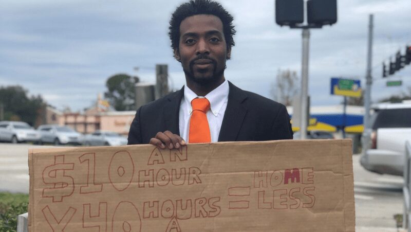 Florida man hands out resumes on the street, turning down cash and saying he wants a career more than money.