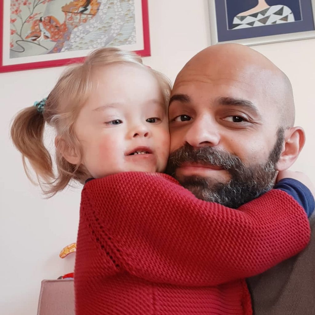 Single gay dad adopts girl with down syndrome who was rejected by 20 families.