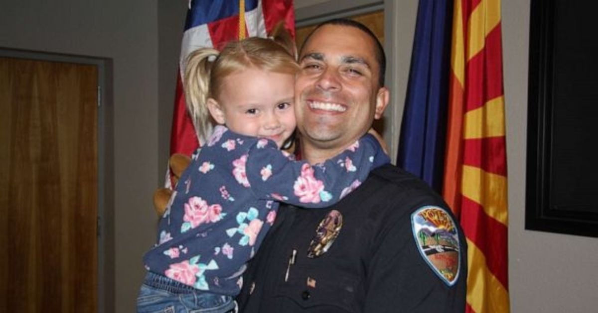 Arizona police officer adopts little girl he connected with while on child abuse call. 