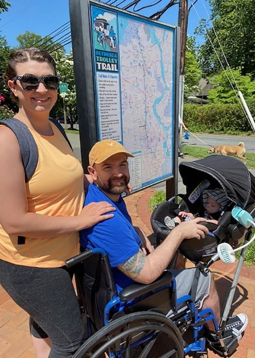 Jeremy and Chelsie King trying out the wheelchair-stroller with their new son Phoenix