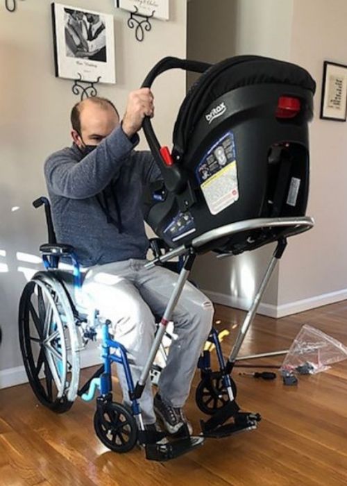 Jeremy King assembling the wheelchair-stroller