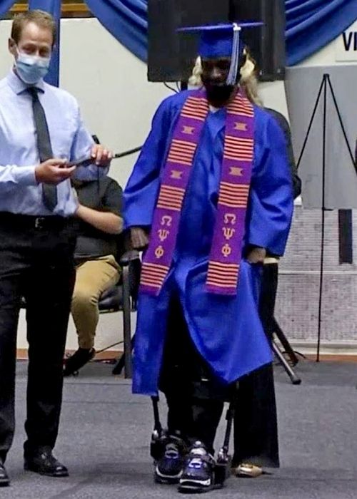 Paralyzed man walks at college graduation after 12 years in a wheelchair.