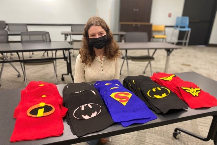 Teen donates 110 handmade superhero capes to families who spent Halloween in the hospital.