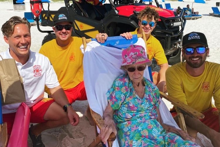 Alabama lifeguards carry 95-year-old woman down to the beach every day.