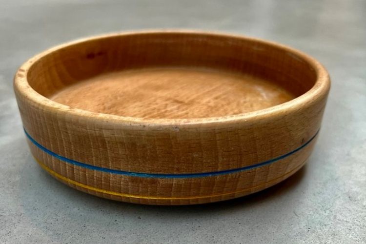 12-year-old woodworker raises nearly $110K for Ukrainian children with raffle of wooden bowl.
