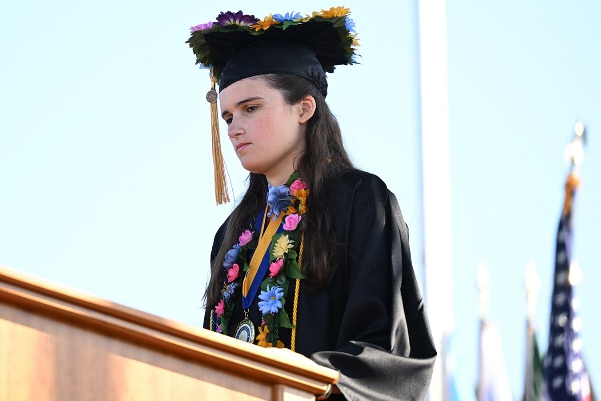 Valedictorian with nonspeaking autism gives powerful commencement speech at college graduation.